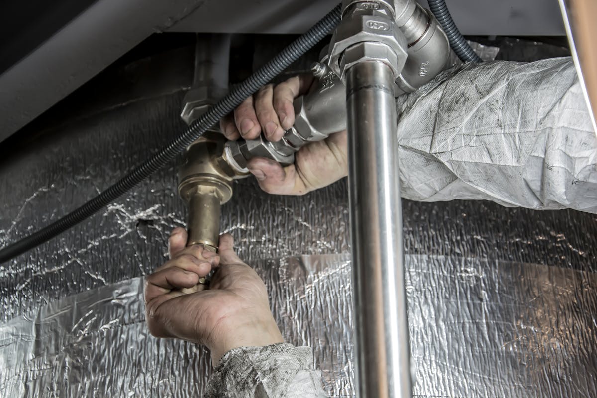 Plumbing contractor on the job